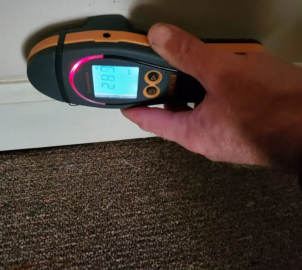 Moisture detection at baseboard during Storm Damage Restoration in Fair Oaks